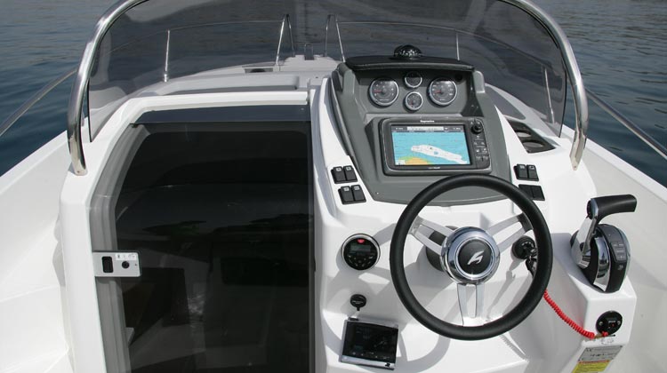 Marine grade electrical switches, compass, media/receiver, USB and 12V sockets and Karnic Deluxe steering wheel